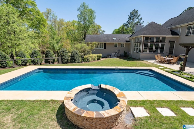 5448 Palomino Trl, Birmingham, AL 35242 - view of swimming pool with a patio area, a pool with connected hot tub, and a lawn
