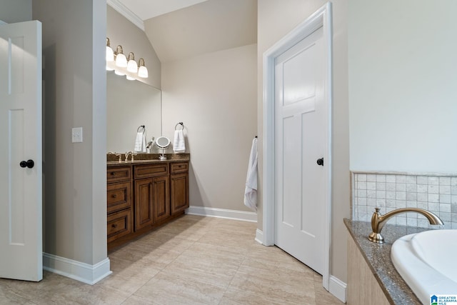 5448 Palomino Trl, Birmingham, AL 35242 - bathroom featuring a tub, tile patterned flooring, baseboards, and vanity