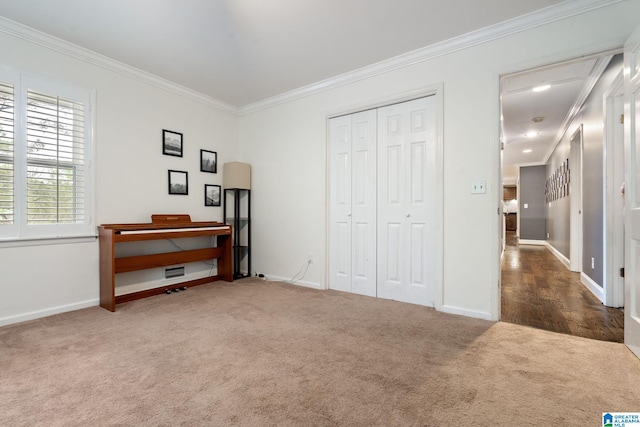 5448 Palomino Trl, Birmingham, AL 35242 - bedroom featuring crown molding, a closet, baseboards, and carpet floors