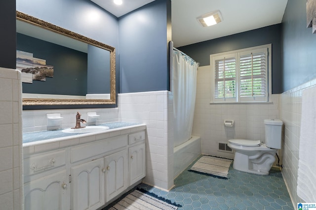 5448 Palomino Trl, Birmingham, AL 35242 - full bath with tile patterned flooring, wainscoting, tile walls, and toilet