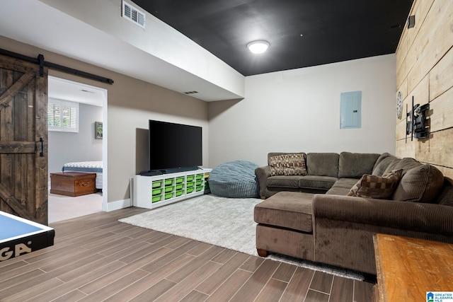 5448 Palomino Trl, Birmingham, AL 35242 - living room with visible vents, wood finished floors, a barn door, and electric panel