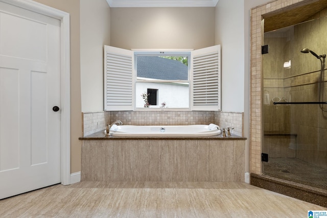 5448 Palomino Trl, Birmingham, AL 35242 - bathroom with a shower stall, a bath, wood finished floors, and crown molding