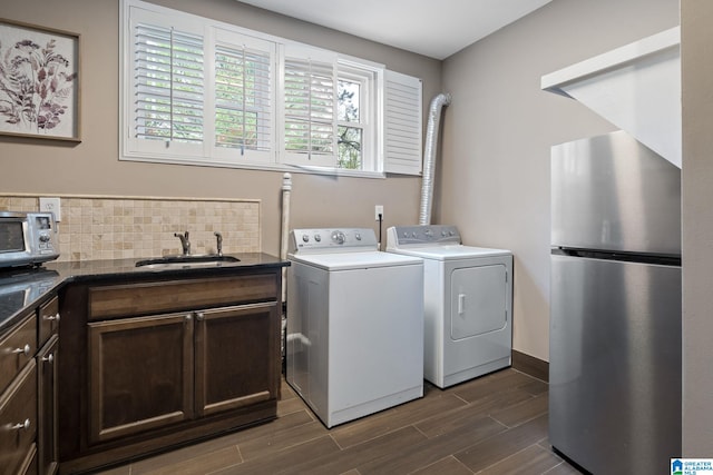 5448 Palomino Trl, Birmingham, AL 35242 - laundry room featuring a toaster, laundry area, dark wood finished floors, washer and dryer, and a sink