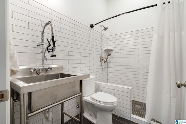 5448 Palomino Trl, Birmingham, AL 35242 - bathroom featuring toilet, tile walls, tiled shower, and tile patterned flooring