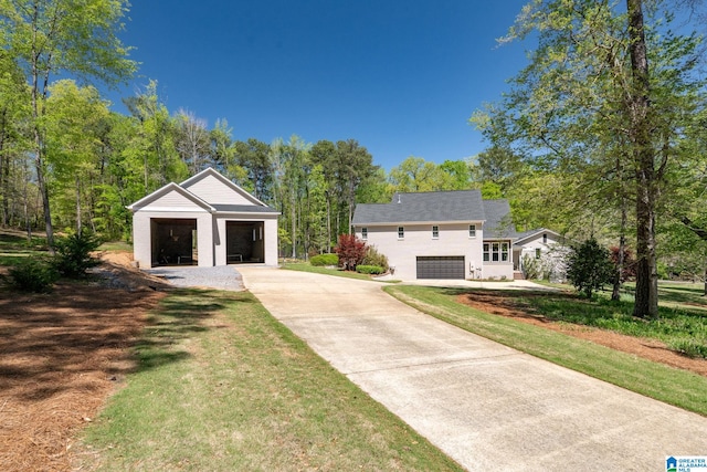 5448 Palomino Trl, Birmingham, AL 35242 - view of front facade featuring concrete driveway, an outdoor structure, a garage, and a front lawn
