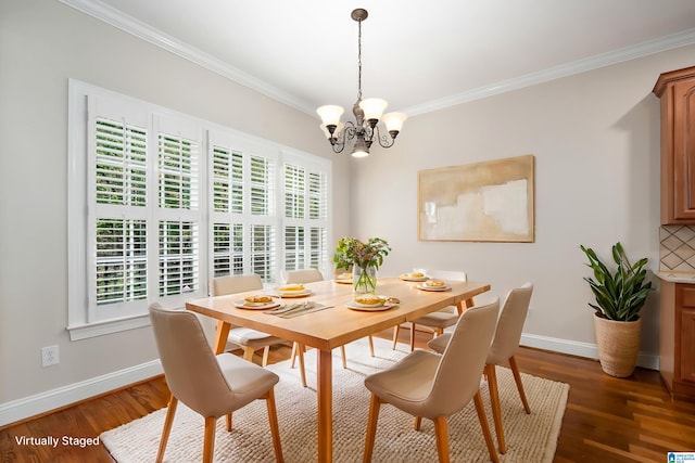 dining area featuring a notable chandelier, baseboards, dark wood-type flooring, and ornamental molding