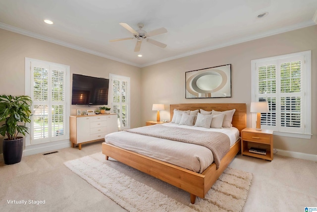 bedroom with crown molding, light carpet, visible vents, and multiple windows