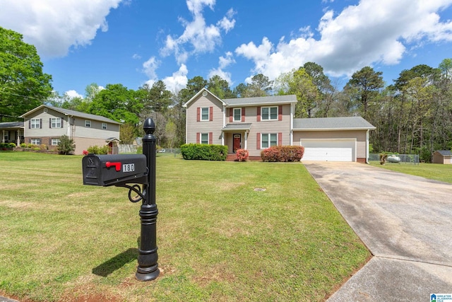 colonial house with a front yard, an attached garage, and concrete driveway