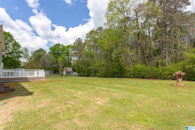 view of yard with a wooden deck