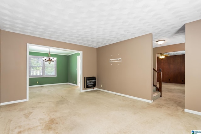unfurnished living room with carpet floors, stairs, baseboards, and heating unit