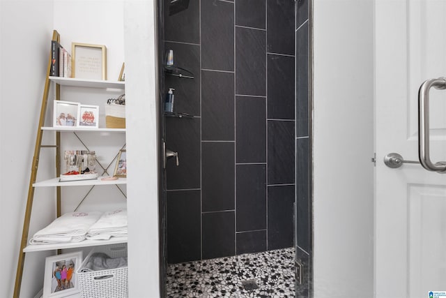 full bathroom with tiled shower