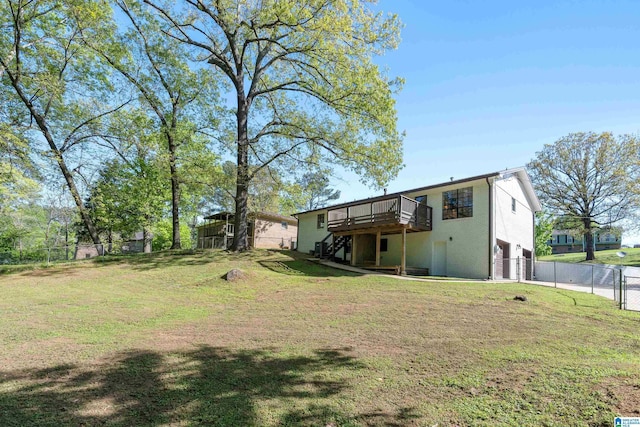 exterior space with a gate, fence, a garage, stairway, and a deck