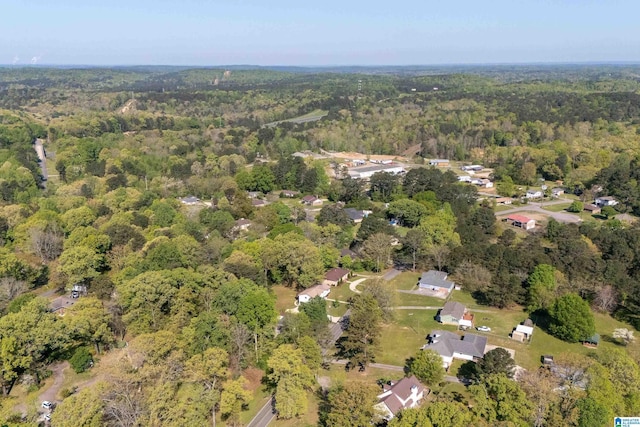 drone / aerial view featuring a view of trees