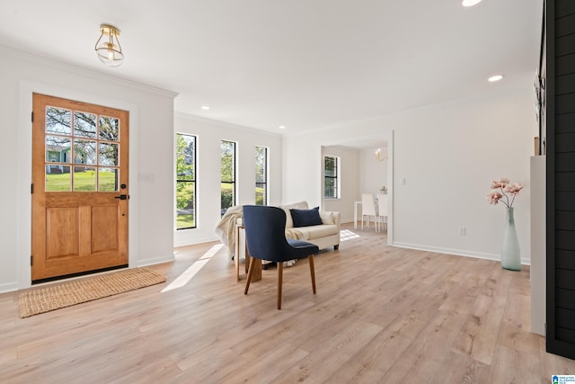 entryway with recessed lighting, light wood finished floors, baseboards, and ornamental molding