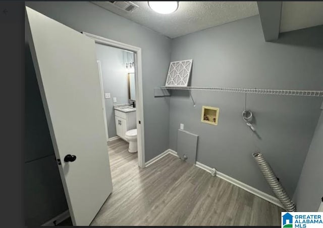 438 Henry St, Birmingham, AL 35214 - washroom featuring light wood-style floors, laundry area, hookup for a washing machine, and visible vents