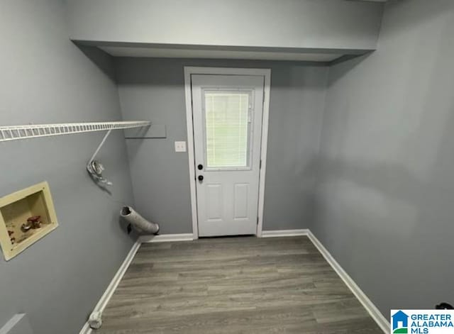 438 Henry St, Birmingham, AL 35214 - laundry area featuring laundry area, wood finished floors, washer hookup, and baseboards