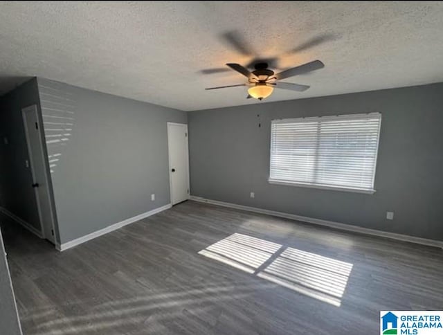 438 Henry St, Birmingham, AL 35214 - unfurnished room featuring wood finished floors, a textured ceiling, baseboards, and ceiling fan