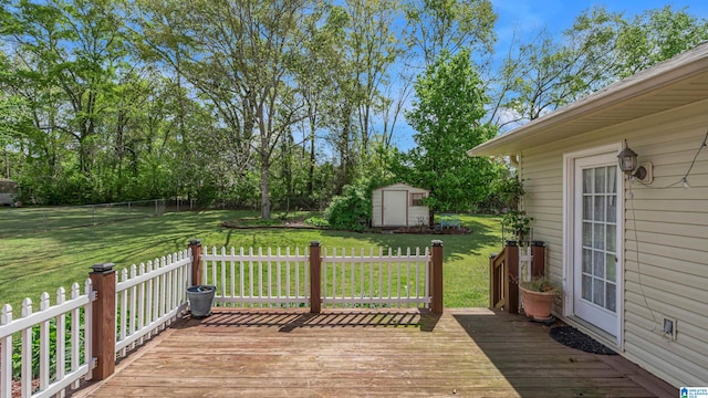 wooden deck with a shed, an outdoor structure, and a lawn