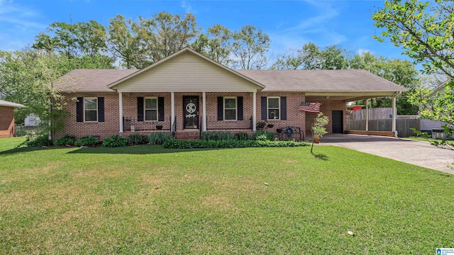 ranch-style home featuring an attached carport, a front yard, brick siding, and driveway