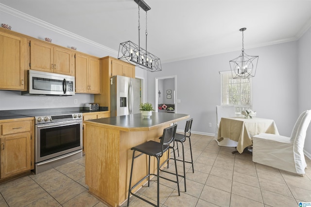 kitchen featuring an inviting chandelier, ornamental molding, light tile patterned flooring, a kitchen island, and stainless steel appliances