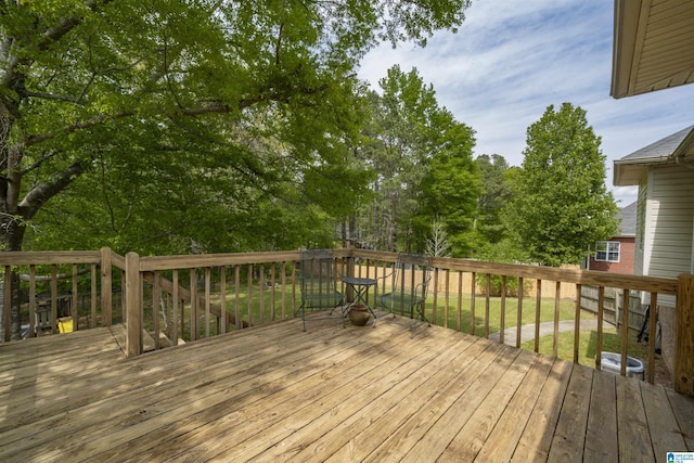 wooden terrace with a yard