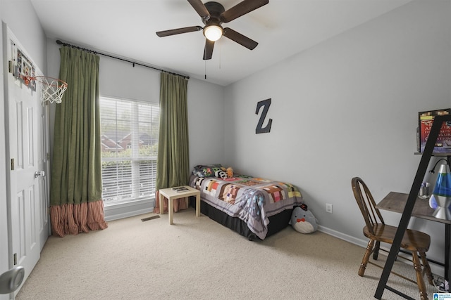 bedroom featuring carpet flooring, visible vents, baseboards, and a ceiling fan