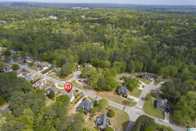 drone / aerial view featuring a view of trees