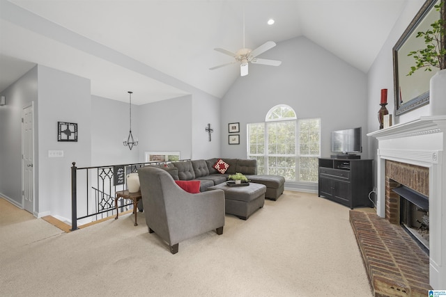 living room with baseboards, a brick fireplace, ceiling fan with notable chandelier, high vaulted ceiling, and carpet flooring