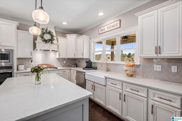 6037 Clubhouse Dr, Trussville, AL 35173 - kitchen with stainless steel appliances, crown molding, decorative backsplash, white cabinets, and pendant lighting