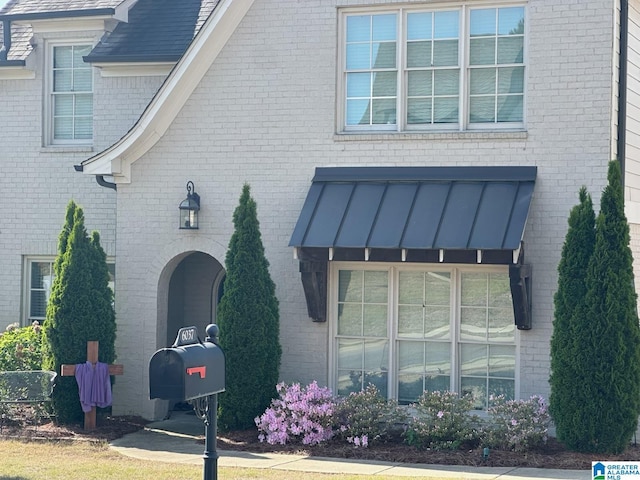 6037 Clubhouse Dr, Trussville, AL 35173 - exterior space featuring a standing seam roof and brick siding