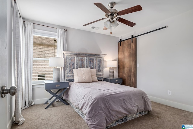6037 Clubhouse Dr, Trussville, AL 35173 - carpeted bedroom featuring a barn door and ceiling fan