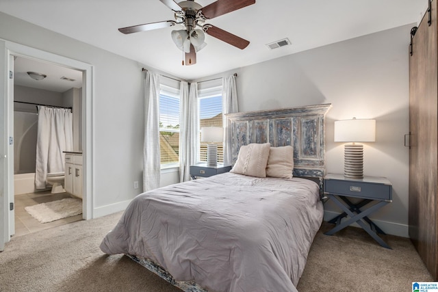 6037 Clubhouse Dr, Trussville, AL 35173 - bedroom with carpet flooring, a barn door, ensuite bathroom, and a ceiling fan