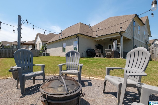 6037 Clubhouse Dr, Trussville, AL 35173 - rear view of house with an outdoor fire pit, brick siding, a shingled roof, and a patio