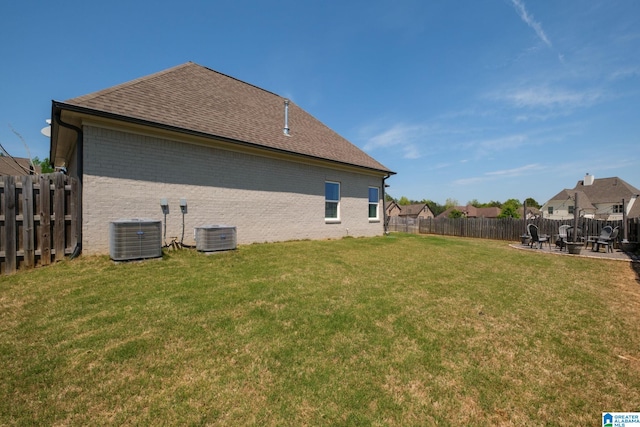 6037 Clubhouse Dr, Trussville, AL 35173 - rear view of house with a patio, brick siding, a fenced backyard, and a shingled roof