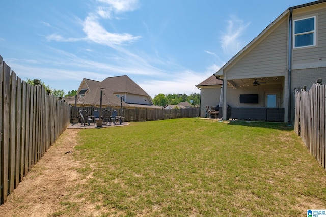 6037 Clubhouse Dr, Trussville, AL 35173 - fenced backyard featuring ceiling fan, a patio area, and a fire pit