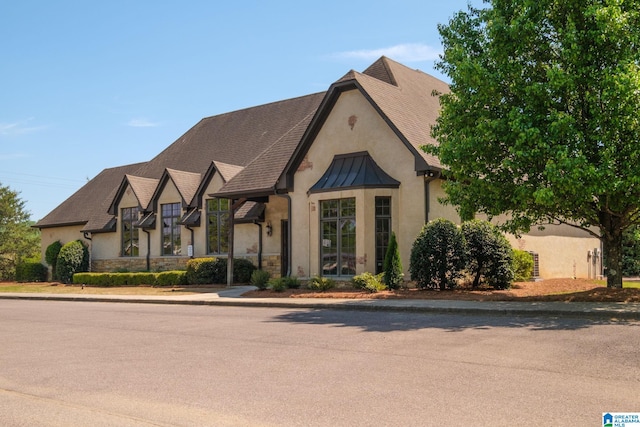 6037 Clubhouse Dr, Trussville, AL 35173 - view of front of home with stucco siding, stone siding, and a standing seam roof