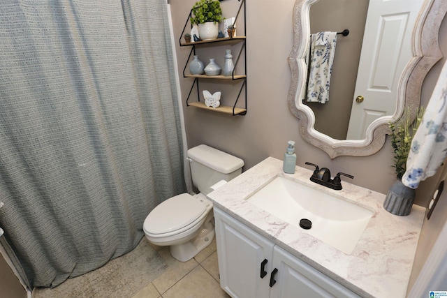 full bathroom featuring toilet, tile patterned flooring, and vanity