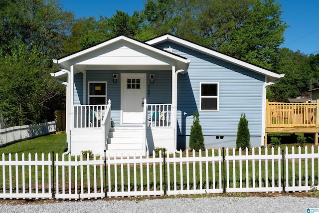 1121 Lawley St, Helena, AL 35080 - view of front of house with a porch, a fenced front yard, and a front lawn