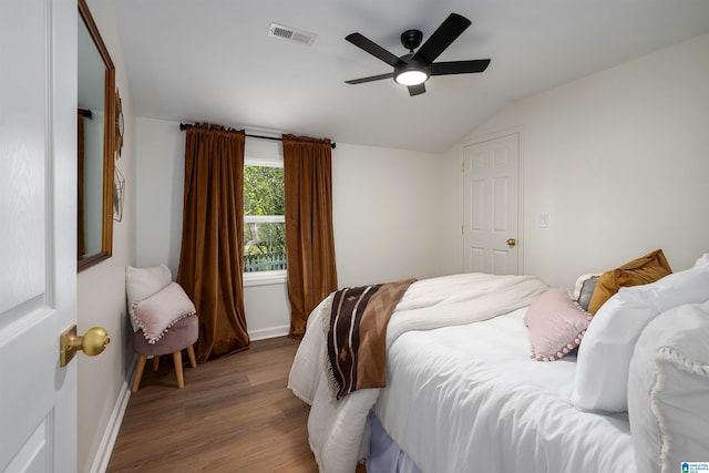 1121 Lawley St, Helena, AL 35080 - bedroom with lofted ceiling, wood finished floors, visible vents, baseboards, and ceiling fan