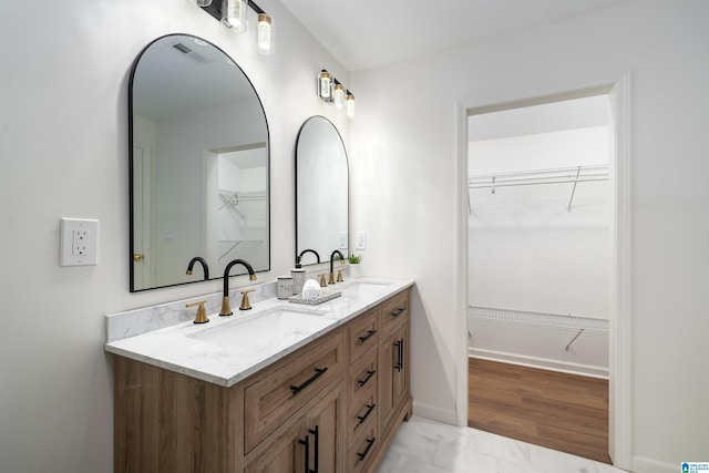 1121 Lawley St, Helena, AL 35080 - full bath featuring a walk in closet, double vanity, visible vents, and a sink