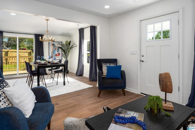 1121 Lawley St, Helena, AL 35080 - living area with recessed lighting, light wood-type flooring, baseboards, and a notable chandelier