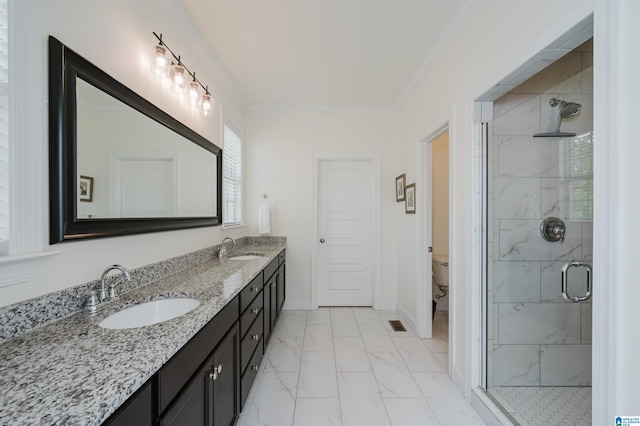 full bathroom featuring marble finish floor, a stall shower, toilet, and a sink