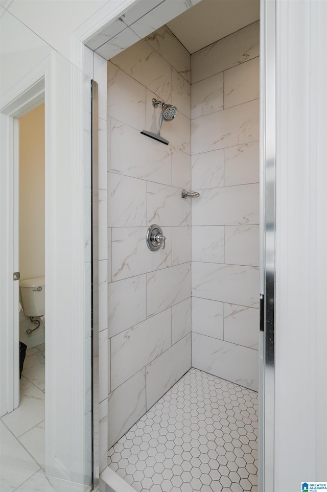 bathroom with a shower stall