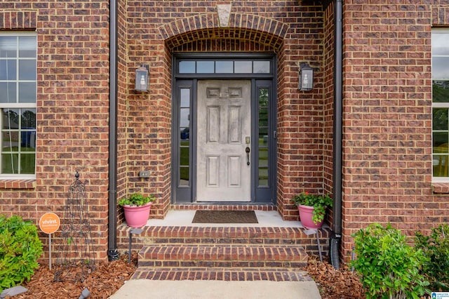 entrance to property with brick siding