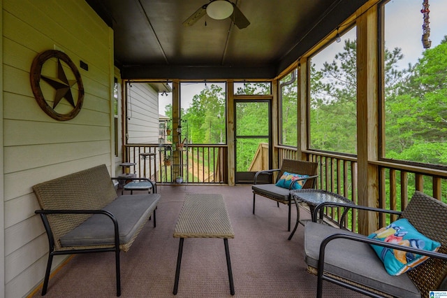 sunroom / solarium with a ceiling fan