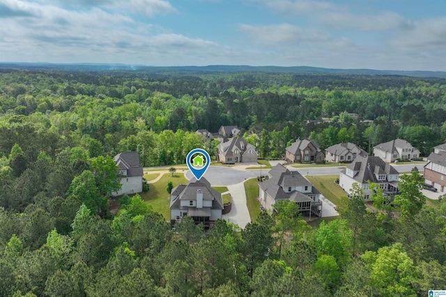 aerial view with a residential view and a view of trees