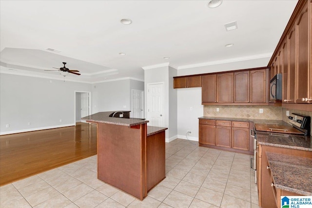 5592 Summit Pointe, Pinson, AL 35126 - kitchen with tasteful backsplash, black microwave, stainless steel electric stove, and dark stone counters