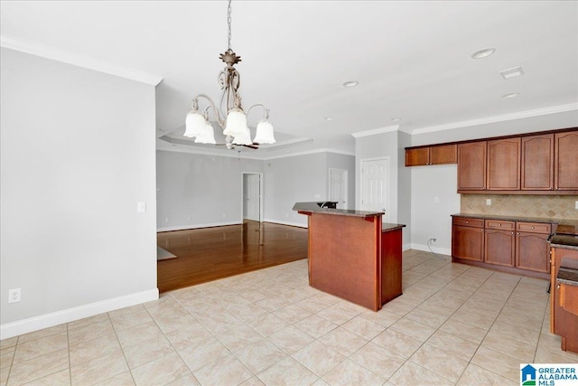 5592 Summit Pointe, Pinson, AL 35126 - kitchen featuring baseboards, decorative light fixtures, an inviting chandelier, ornamental molding, and backsplash