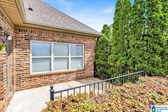 5592 Summit Pointe, Pinson, AL 35126 - view of property exterior with brick siding, fence, and a shingled roof
