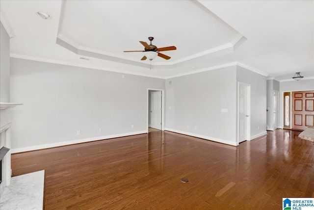 5592 Summit Pointe, Pinson, AL 35126 - unfurnished living room featuring baseboards, a ceiling fan, a fireplace with flush hearth, a raised ceiling, and wood finished floors